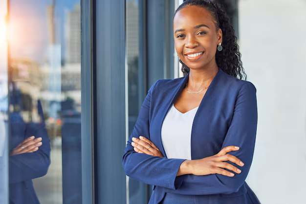 portrait-window-arms-crossed-with-business-woman-standing-her-professional-office-smile-corporate-leadership-with-happy-african-manager-boss-workplace-empowerment_590464-208466 - KUA HOMES